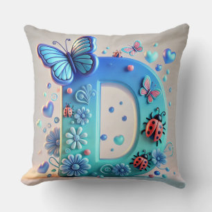 Helder 3D-letter D met vlinders, lieveheersbeestje Kussen