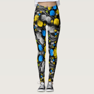 Helder abstract bloemmotief op zwarte achtergrond leggings