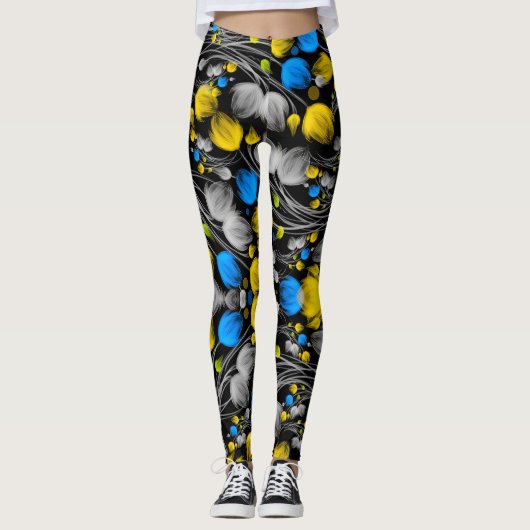 Helder abstract bloemmotief op zwarte achtergrond leggings (Voorkant)