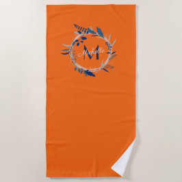 Helder oranje en blauwe kransnaam met monogram strandlaken