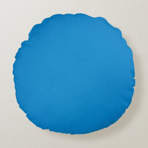 Helderblauw met korrelige textuur rond kussen