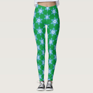 Heldere blauwe sneeuwvlokken op heldere groene Leg Leggings