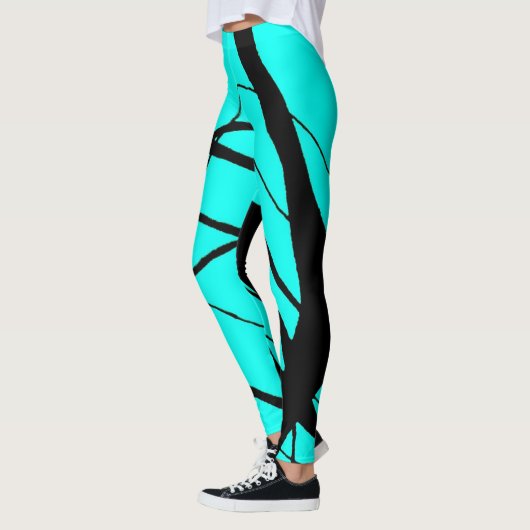 Heldere Blauwgroen en zwarte lineaire Leggings (Links)