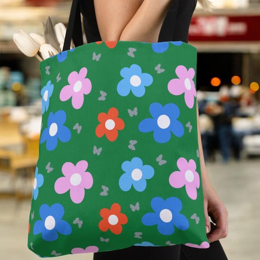 Heldere bloemen en vlinders tote bag