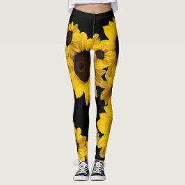 Heldere gele zonnebloemen op zwarte achtergrond leggings