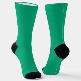heldere groene sokken met zwarte hielen en tenen