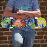 Heldere Kleurrijke Mozaïek Tegel Koi Visvijver Persoonlijk Skateboard<br><div class="desc">Dit veelkleurige ontwerp is voorzien van een koivijver gemaakt van kleurrijke mozaïek tegels gedompeld in zonlicht en schaduw. Een groene koi vis lijkt te zijn gestopt om de felrode bloem te ruiken,  maar er is geen stoppen met deze levendige bord. Dit afbeelding is originele mozaïekkunstfotografie van JLW_PHOTOGRAPHY.</div>
