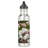 Heldere witte en roze tulpen op een zonnige waterfles  (Links)