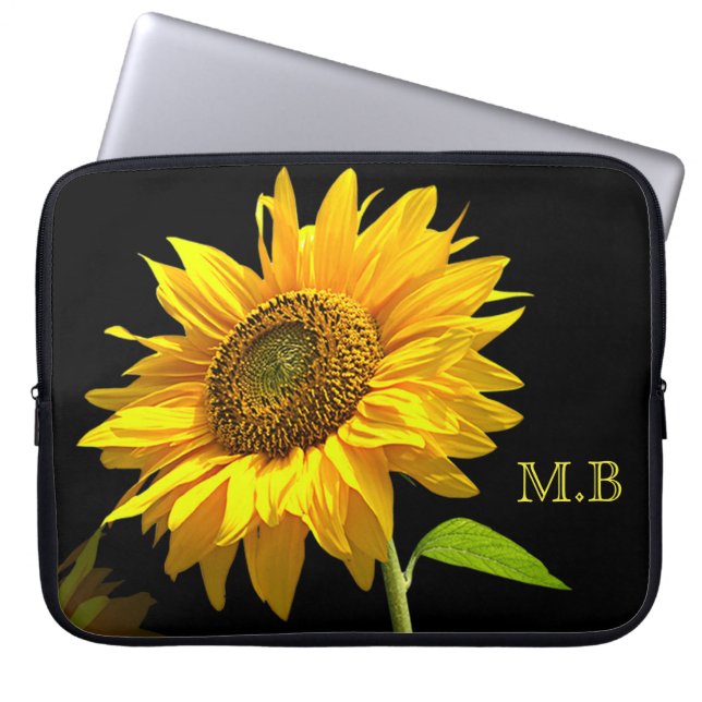 Heldere zonnebloem op zwarte achtergrond laptop sleeve (Voorkant)