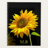 Heldere zonnebloem op zwarte achtergrond planner (Voorkant)