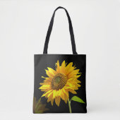 Heldere zonnebloem op zwarte achtergrond tote bag (Voorkant)