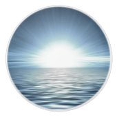Heldere zonsopgang over de blauwe oceaandresser keramische knop (Voorkant)