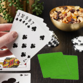 Heldergroene gestructureerde oppervlakte draaiend pokerkaarten (Insitu)