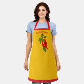 Helderrode paprika's aan de rank schort (Gedragen)