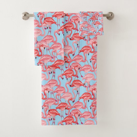 Helderroze lamingos op blauw bad handdoek (Insitu)