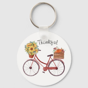 Herfst.  fiets met pompoenen, zonnebloemen sleutelhanger