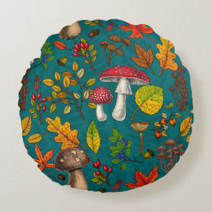 Herfst paddenstoelen, bladeren, noten en bessen op rond kussen