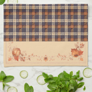 Herfstbladeren en bloemen op plaid theedoek