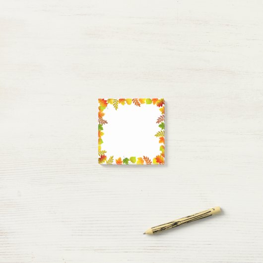 Herfstbladeren op wit post-it® notes (Op bureau)