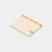 Herfstbladeren, spook, pompoen en kaars op beige post-it® notes (Schuin)