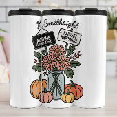 Herfstbloemenmarkt en pompoen thermosbeker