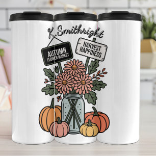 Herfstbloemenmarkt en pompoen thermosbeker