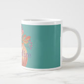 Herfstpompoen bloementerracotta sinaasappel en bla grote koffiekop (Rechts)