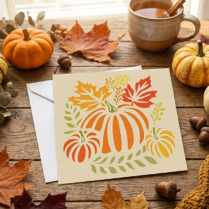 Herfstpompoen en vallende bladeren kaart