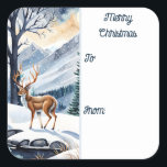 Herten bij het Snowy Lake Christmas Gift label<br><div class="desc">Kerst naar en van Sticker Gift Label. Een rustige scène overdag waar de wonderen van de natuur tot leven komen. Te midden van met sneeuw bedekte bossen,  majestueuze bergen en een rustig meer,  voegt een sierlijk hert een vleugje magie toe aan het landschap.</div>