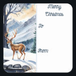 Herten bij het Snowy Lake Christmas Gift label<br><div class="desc">Kerst naar en van Sticker Gift Label. Een rustige scène overdag waar de wonderen van de natuur tot leven komen. Te midden van met sneeuw bedekte bossen,  majestueuze bergen en een rustig meer,  voegt een sierlijk hert een vleugje magie toe aan het landschap.</div>
