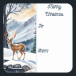 Herten bij het Snowy Lake Christmas Gift label<br><div class="desc">Kerst naar en van Sticker Gift Label. Een rustige scène overdag waar de wonderen van de natuur tot leven komen. Te midden van met sneeuw bedekte bossen,  majestueuze bergen en een rustig meer,  voegt een sierlijk hert een vleugje magie toe aan het landschap.</div>