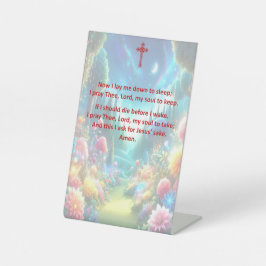 Het bedtijdgebed van een kind op een voetstuk reclamebord met voetstuk