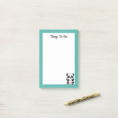 Het Beer van Panda op Blauwgroen en wit Post-it® Notes (Op bureau)