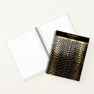 Het bestuderen van zwart en goudkleurige slangpatr notitieboek