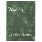 Het dromen van een witte kerstsnowflakes op groen klembord (Achterkant)