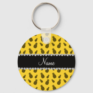 Het gepersonaliseerde patroon van de naam gele sleutelhanger