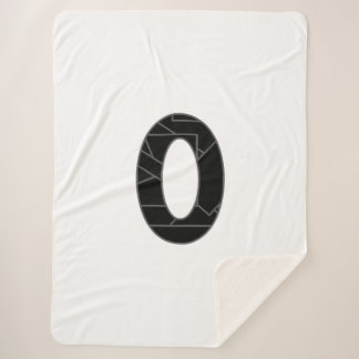 Het getal nul (0) in zwart sherpa deken