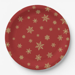 Het Goud van het Ontwerp van sneeuwvlokken op Rood Papieren Bordje