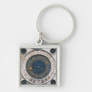 Het gouden en enamel klokgezicht, ontwerp waarmee  sleutelhanger