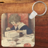 Het inpakken van kerstcadeaus, Jessie Willcox Smit Sleutelhanger (Achterkant)