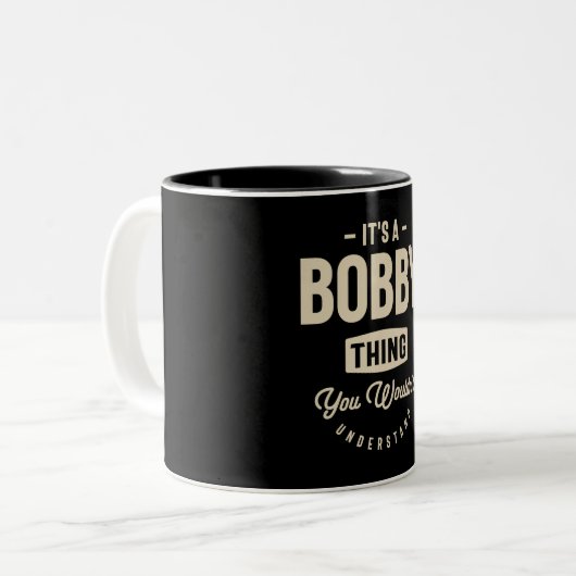 Het is een Bobby Thing, naam Bobby Tweekleurige Koffiemok (Voorkant links)
