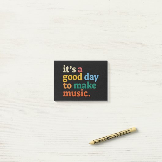 Het is een goede dag om muziek te maken post-it® notes (Op bureau)