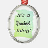 Het is een jaarboek. metalen ornament (Links)