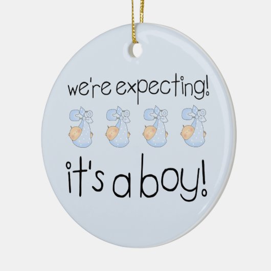 Het is een jongen keramisch ornament (Links)