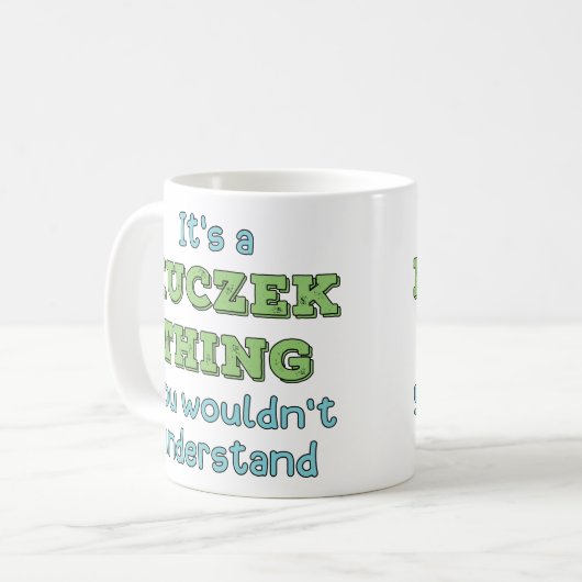 Het is een Kuczek ding Koffiemok (Voorkant links)