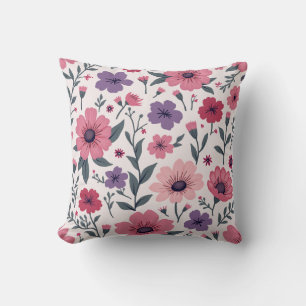 Het is een kussen gemengd met roze bloemen en paar