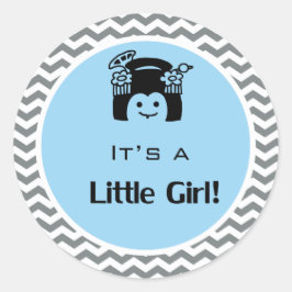 Het is een meisje blauw, grijze sticker. ronde sticker