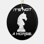 Het is geen paardenschotel. keramisch ornament (Links)