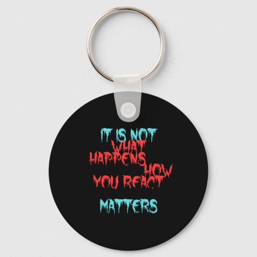 Het is niet wat je overkomt sleutelhanger (Voorkant)