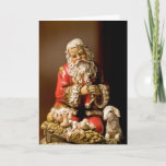 Het knielen Kerstman Feestdagen Kaart<br><div class="desc">De het knielen Kerstman, die het Kind van Christus aanbidden, is één van mijn favoriete afbeeldingen van Kerstmis. Ik heb het aan het gebed van de Kerstman binnen de kaart gekoppeld. Ik denk dit tot een zeer speciale groet aan vrienden en familie tijdens dit heilige seizoen van het jaar zou...</div>